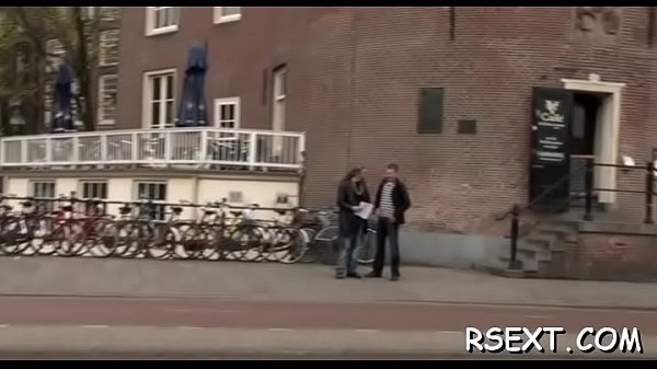 Hot hooker with big fake boobs gives a steaming hot oral sex job