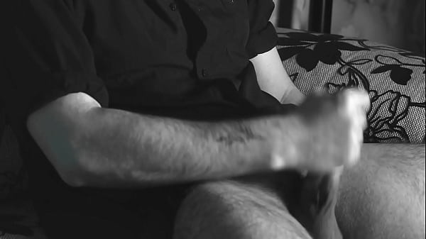 The boy jerks off close-up with a condom and cums loudly into it.