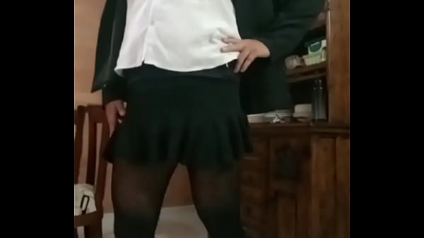 Latina crossdresser Liseth models in sexy dress, showing her legs and penis